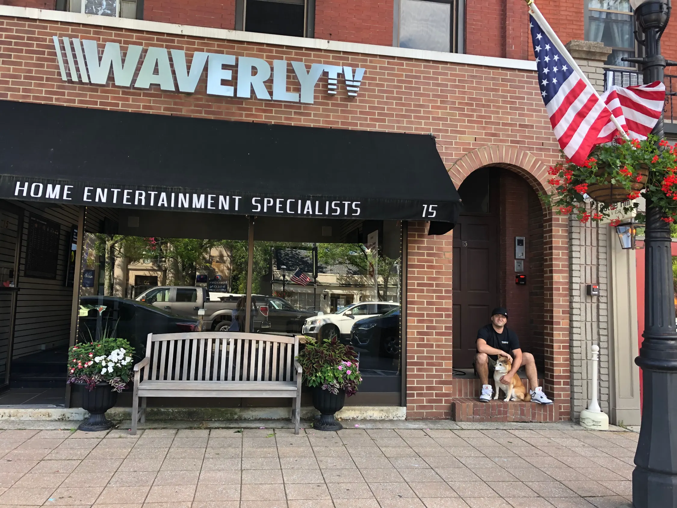 Joe Sainato in front of the Waverly TV showroom sign in Madison, NJ