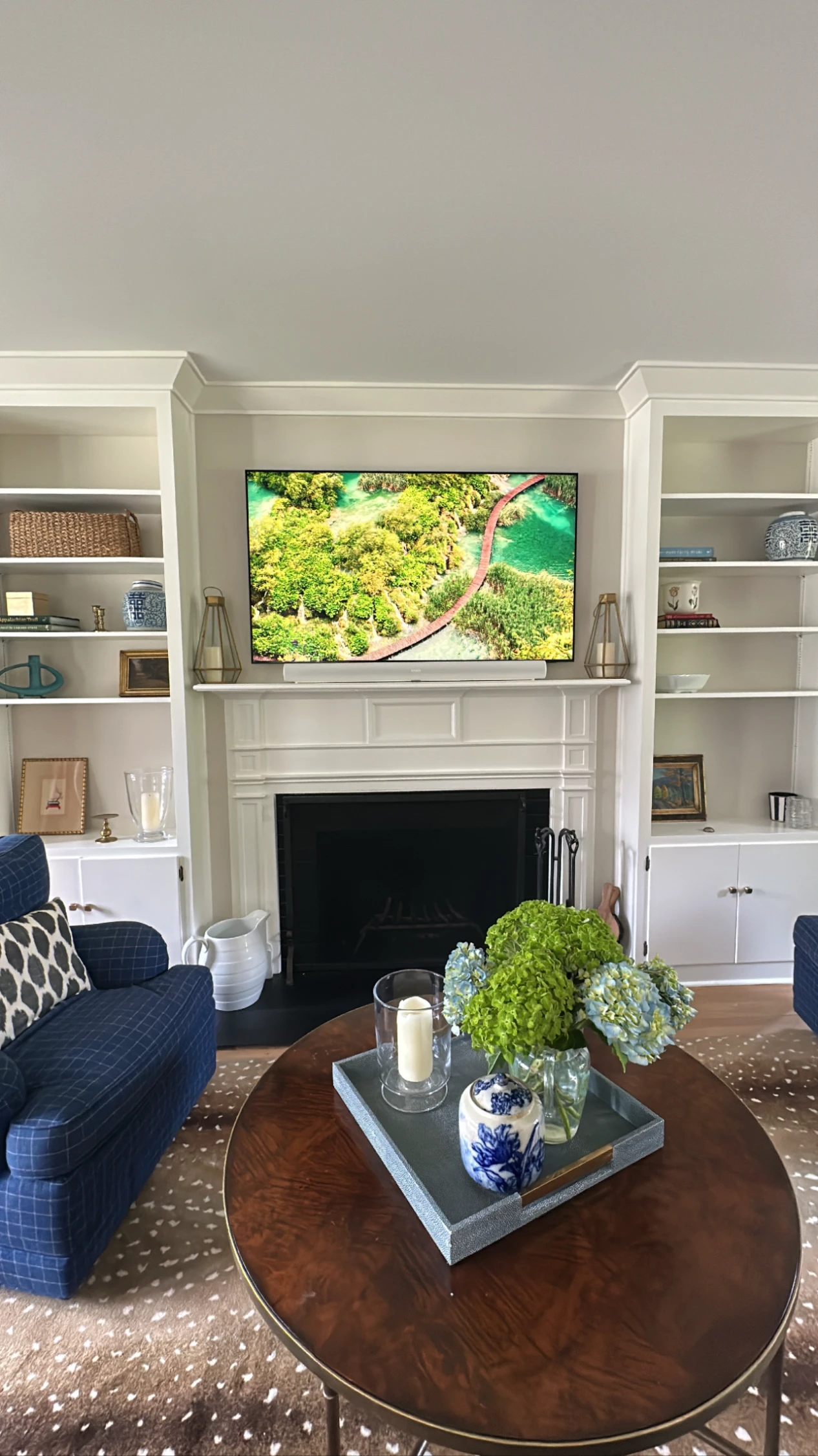 TV installation in a family room with built-in bookshelves