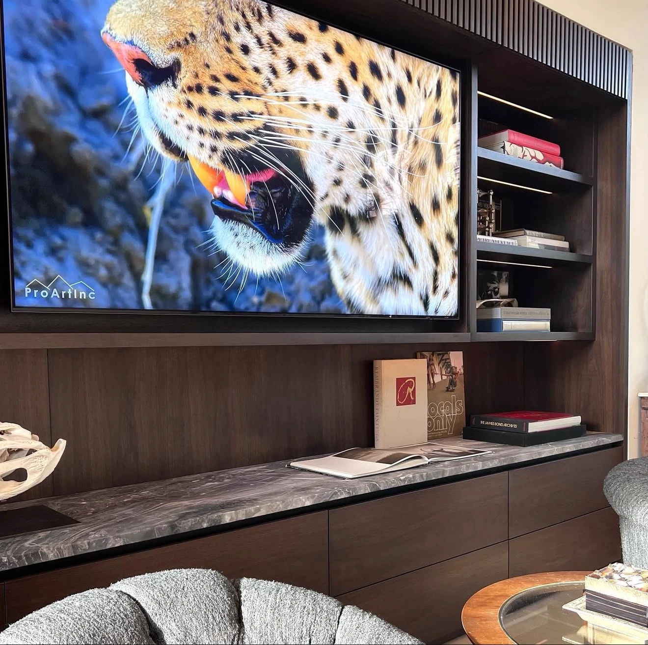 TV mounted in a wood cabinet surround