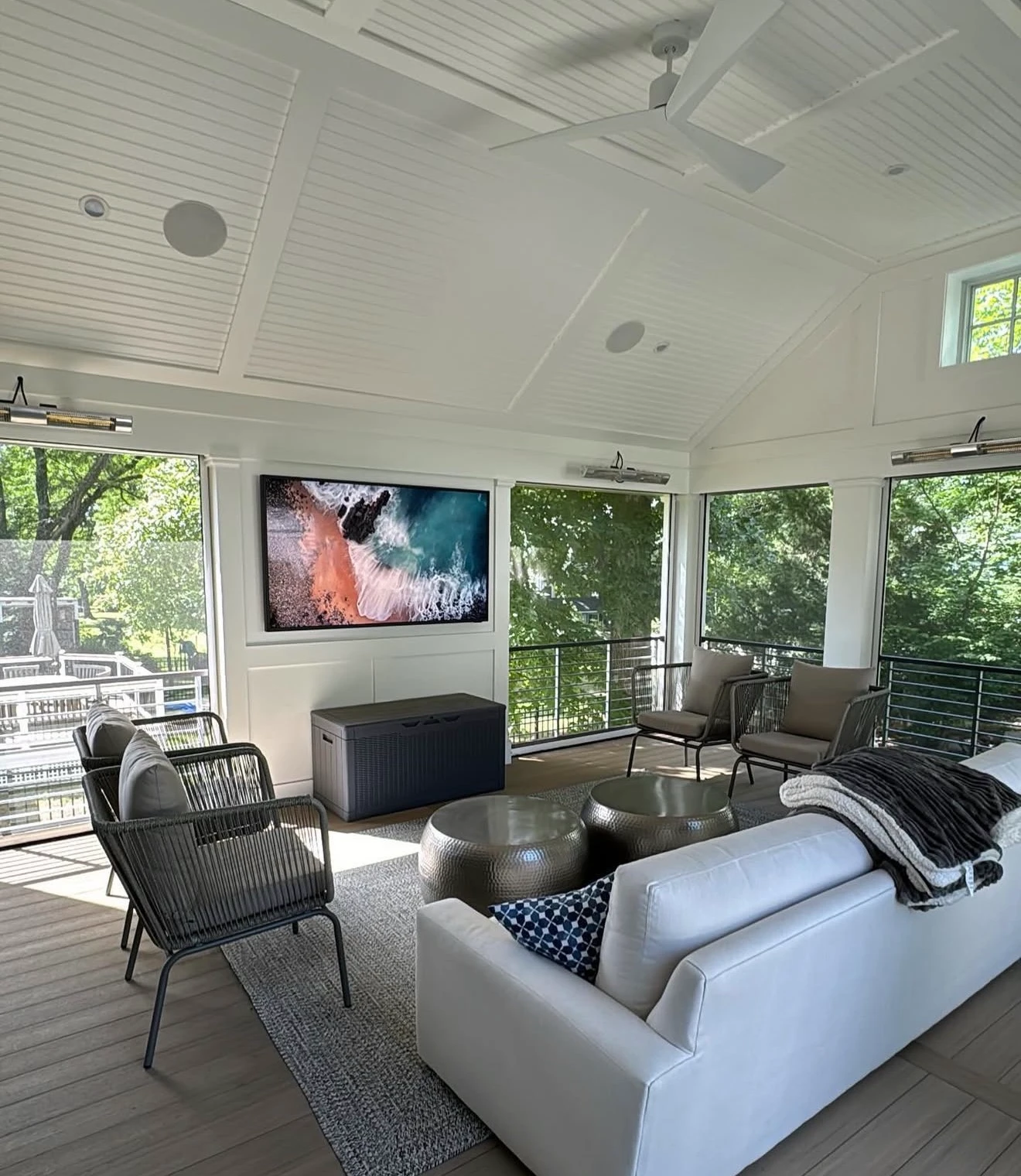 Screened-in porch with mounted TV