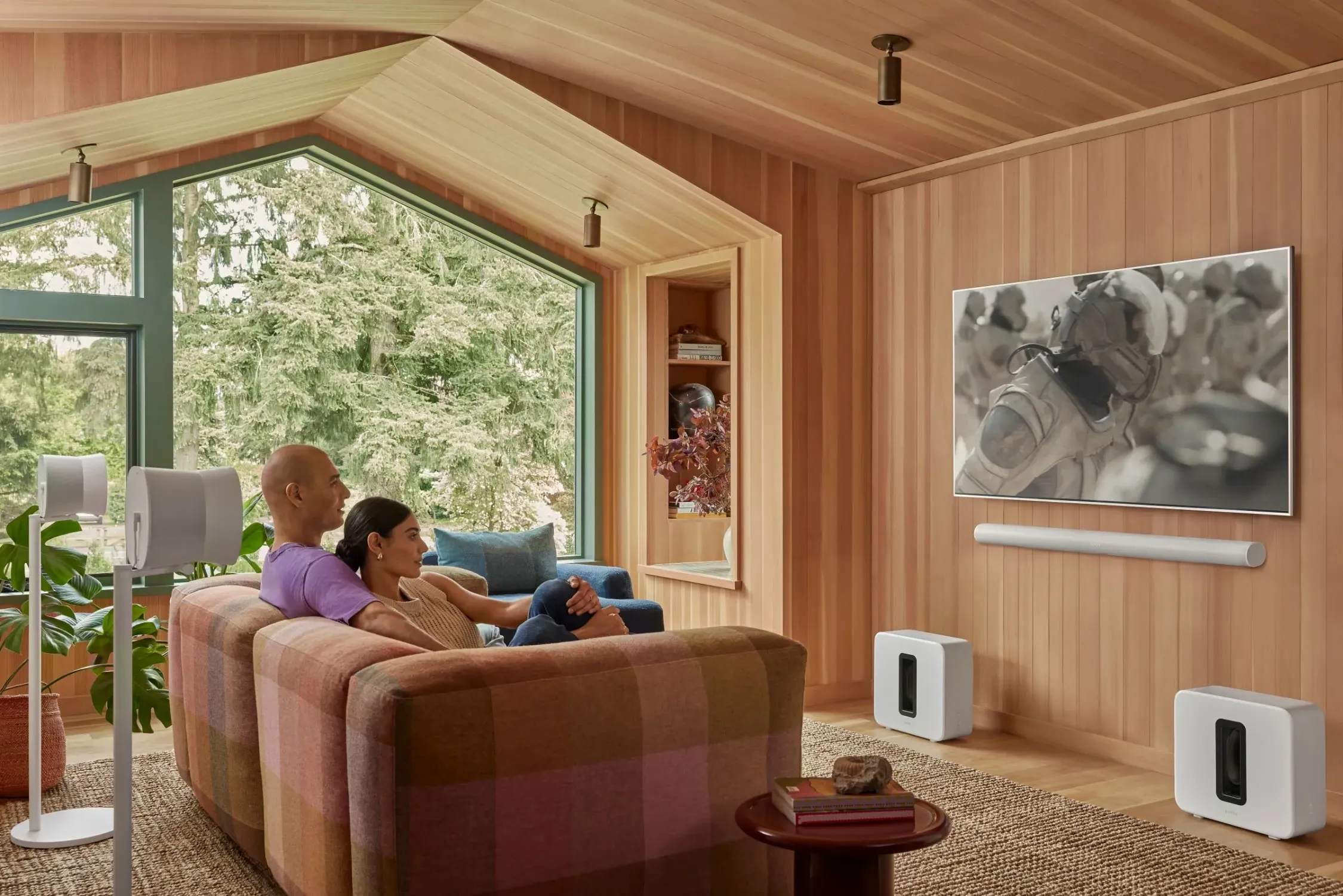 Television professionally mounted over a fireplace in a modern family room